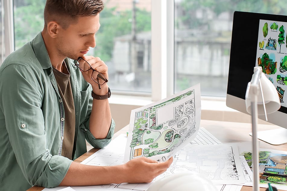 landscape architect reviewing plans 